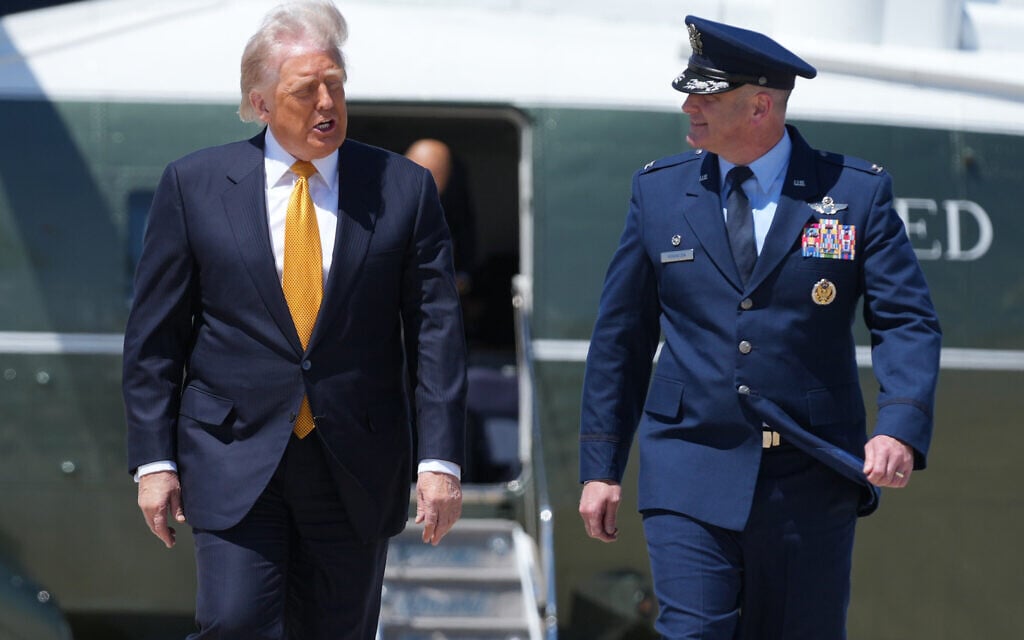 US President Donald Trump walks to board Air Force One with Air Force Col. Christopher M. Robinson, commander of the 89th Airlift Wing, Tuesday, May 12, 2026, at Joint Base Andrews, Maryland, for a trip to China. (AP Photo/Mark Schiefelbein) US President Donald Trump walks to board Air Force One with Air Force Col. Christopher M. Robinson, commander of the 89th Airlift Wing, Tuesday, May 12, 2026, at Joint Base Andrews, Maryland, for a trip to China. (AP Photo/Mark Schiefelbein)