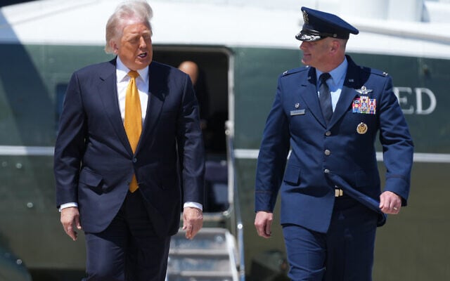 US President Donald Trump walks to board Air Force One with Air Force Col. Christopher M. Robinson, commander of the 89th Airlift Wing, Tuesday, May 12, 2026, at Joint Base Andrews, Maryland, for a trip to China. (AP Photo/Mark Schiefelbein) US President Donald Trump walks to board Air Force One with Air Force Col. Christopher M. Robinson, commander of the 89th Airlift Wing, Tuesday, May 12, 2026, at Joint Base Andrews, Maryland, for a trip to China. (AP Photo/Mark Schiefelbein)