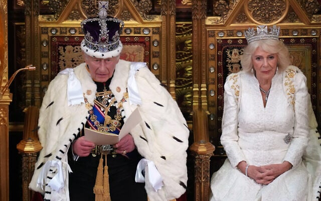 Britain's King Charles III speaks as he sits besides Queen Camilla during the State Opening of Parliament at the Palace of Westminster in London, May 13, 2026.(AP Photo/Kirsty Wigglesworth, Pool)