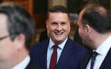 British Health Secretary Wes Streeting walks through the House of Commons to attend the State Opening of Parliament at the Palace of Westminster, London, May 13, 2026. (Toby Melville/Pool Photo via AP)