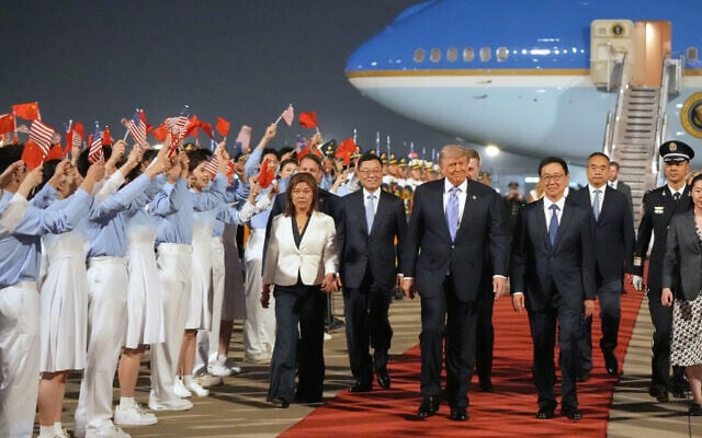 US President Donald Trump walks with China's Vice President Han Zheng during a welcome ceremony at Beijing Capital International Airport in Beijing, May 13, 2026. (Mark Schiefelbein/AP) US President Donald Trump walks with China's Vice President Han Zheng during a welcome ceremony at Beijing Capital International Airport in Beijing, May 13, 2026. (Mark Schiefelbein/AP)