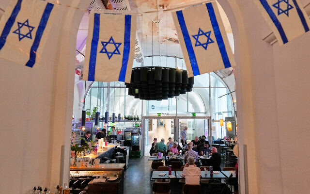 Israeli flags hang in the designated Israel "Euro Cafe" MQ Kantine during the 70th Eurovision Song Contest week in Vienna, Austria, May 13, 2026. (AP/Martin Meissner) Israeli flags hang in the designated Israel "Euro Cafe" MQ Kantine during the 70th Eurovision Song Contest week in Vienna, Austria, May 13, 2026. (AP/Martin Meissner)
