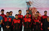 Iran's national soccer team players stand onstage as they are greeted by a crowd during a pro-government gathering before their departure for training and friendly matches in Turkey ahead of the World Cup at Islamic Revolution Square in Tehran, Iran, May 13, 2026. (AP/Vahid Salemi)