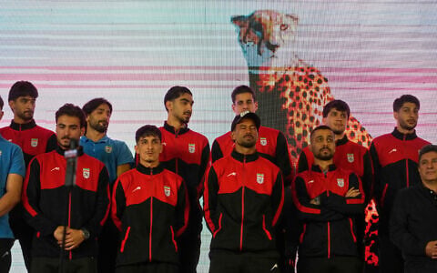 Iran's national soccer team players stand onstage as they are greeted by a crowd during a pro-government gathering before their departure for training and friendly matches in Turkey ahead of the World Cup at Islamic Revolution Square in Tehran, Iran, May 13, 2026. (AP/Vahid Salemi)