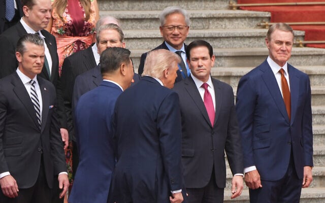 US President Donald Trump participates in a welcome ceremony with China's President Xi Jinping at the Great Hall of the People, May 14, 2026, in Beijing, as Defense Secretary Pete Hegseth, Treasury Secretary Scott Bessent, Secretary of State Marco Rubio, Apple CEO Tim Cook, Elon Musk and Nvidia CEO Jensen Huang watch. (AP Photo/ Mark Schiefelbein) US President Donald Trump participates in a welcome ceremony with China's President Xi Jinping at the Great Hall of the People, May 14, 2026, in Beijing, as Defense Secretary Pete Hegseth, Treasury Secretary Scott Bessent, Secretary of State Marco Rubio, Apple CEO Tim Cook, Elon Musk and Nvidia CEO Jensen Huang watch. (AP Photo/ Mark Schiefelbein)