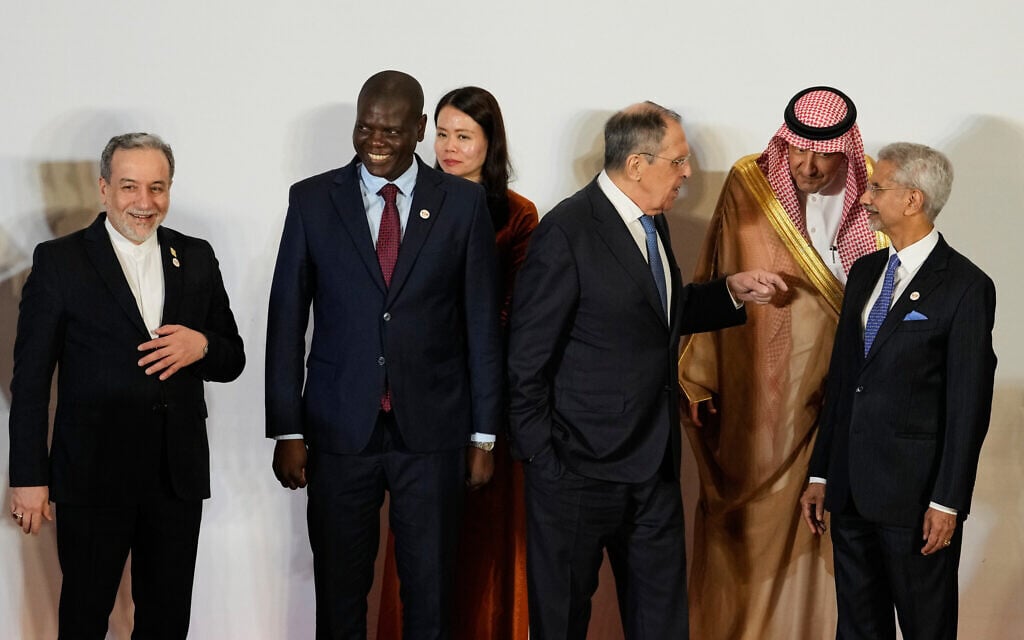 Russia's Foreign Minister Sergey Lavrov, third right, talks to Vice Minister of Foreign Affairs of Saudi Arabia, Waleed bin Abdulkarim, second right, as Indian Foreign Minister S.Jaishankar, right, South Africa's Minister of Foreign Affairs Ronald Lamola, second left, Iranian Foreign Minister Abbas Araghchi, left, and and Vietnam Deputy Foreign Minister Nguyen Hang, third left, watch at a photo call of Government representatives and partner countries of BRICS during a two day meeting in New Delhi, India, May 14, 2026. (AP Photo/Manish Swarup)