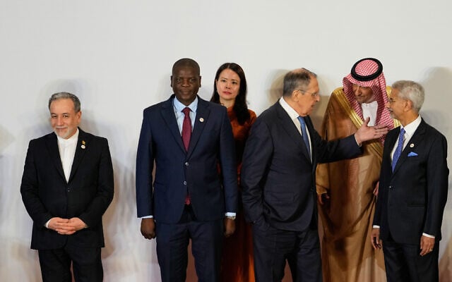 Russia's Foreign Minister Sergey Lavrov, third right, talks to Vice Minister of Foreign Affairs of Saudi Arabia, Waleed bin Abdulkarim, second right, as Indian Foreign Minister S.Jaishankar, right, South Africa's Minister of Foreign Affairs Ronald Lamola, second left, Iranian Foreign Minister Abbas Araghchi, left, and and Vietnam Deputy Foreign Minister Nguyen Hang, third left, watch at a photo call of Government representatives and partner countries of BRICS during a two day meeting in New Delhi, India, on May 14, 2026. (AP Photo/Manish Swarup) Russia's Foreign Minister Sergey Lavrov, third right, talks to Vice Minister of Foreign Affairs of Saudi Arabia, Waleed bin Abdulkarim, second right, as Indian Foreign Minister S.Jaishankar, right, South Africa's Minister of Foreign Affairs Ronald Lamola, second left, Iranian Foreign Minister Abbas Araghchi, left, and and Vietnam Deputy Foreign Minister Nguyen Hang, third left, watch at a photo call of Government representatives and partner countries of BRICS during a two day meeting in New Delhi, India, on May 14, 2026. (AP Photo/Manish Swarup)