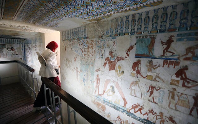 A visitor leaves the tomb of RabuIa, door keeper of Amun during the 18th Dynasty, after restorations help by the Zahi Hawass Foundation for Heritage and Antiquities in Luxor, Egypt, May 14, 2026. (AP Photo)