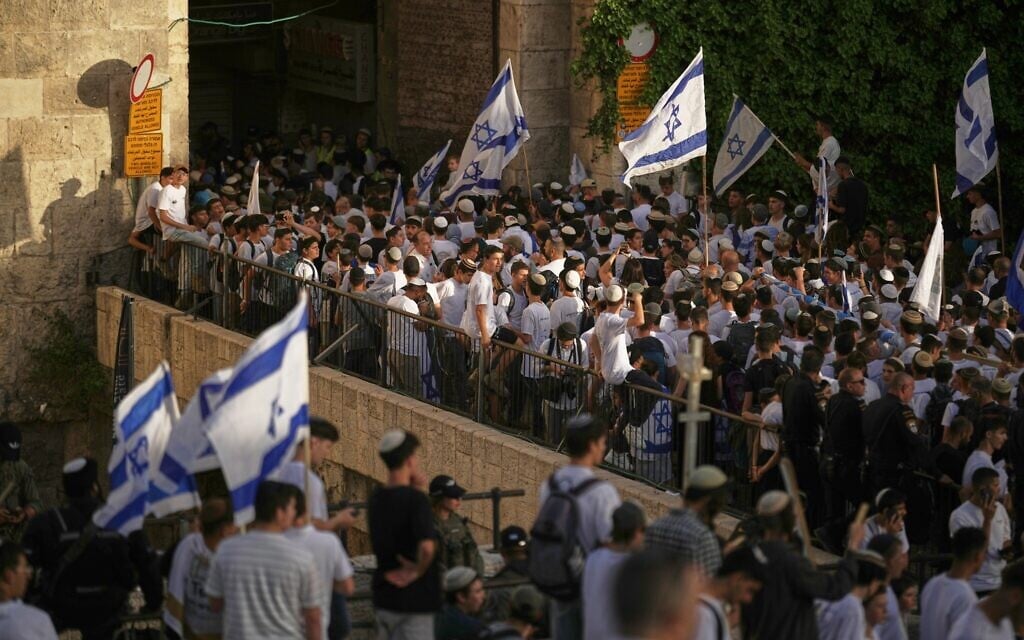 Israelis gather march through Damascus Gate during the annual Jerusalem Day march commemorating Israel's capture of the Old City and East Jerusalem from Jordan during the 1967 Six Day War, May 14, 2026. (AP Photo/Leo Correa)