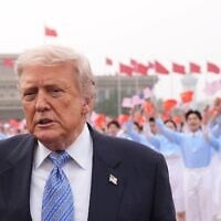 US President Donald Trump walks to board Air Force One, Friday, May 15, 2026, at Beijing Capital International Airport in Beijing. (AP Photo/Mark Schiefelbein)