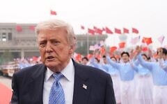 US President Donald Trump walks to board Air Force One, Friday, May 15, 2026, at Beijing Capital International Airport in Beijing. (AP Photo/Mark Schiefelbein)