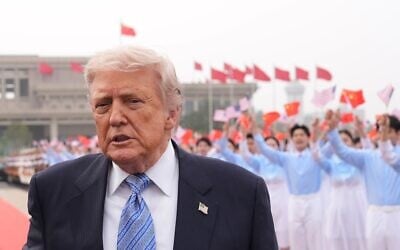 US President Donald Trump walks to board Air Force One, Friday, May 15, 2026, at Beijing Capital International Airport in Beijing. (AP Photo/Mark Schiefelbein)
