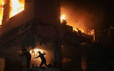 Palestinians react to a fire following an Israeli strike on a residential building in the Rimal neighborhood of Gaza City, Friday, May 15, 2026. (AP Photo/Jehad Alshrafi) Palestinians react to a fire following an Israeli strike on a residential building in the Rimal neighborhood of Gaza City, Friday, May 15, 2026. (AP Photo/Jehad Alshrafi)