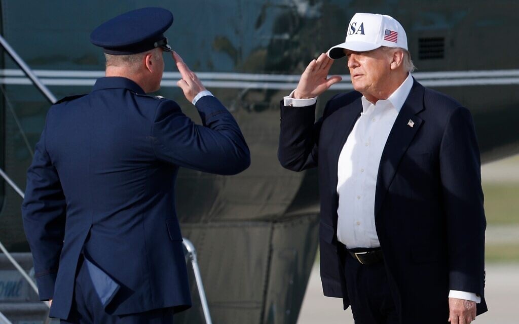 US President Donald Trump, right, salutes Air Force Col. Christopher M. Robinson, commander of the 89th Airlift Wing, left, before boarding Marine One upon his arrival at Joint Base Andrews, Maryland, May 15, 2026. (AP Photo/Luis M. Alvarez) US President Donald Trump, right, salutes Air Force Col. Christopher M. Robinson, commander of the 89th Airlift Wing, left, before boarding Marine One upon his arrival at Joint Base Andrews, Maryland, May 15, 2026. (AP Photo/Luis M. Alvarez)