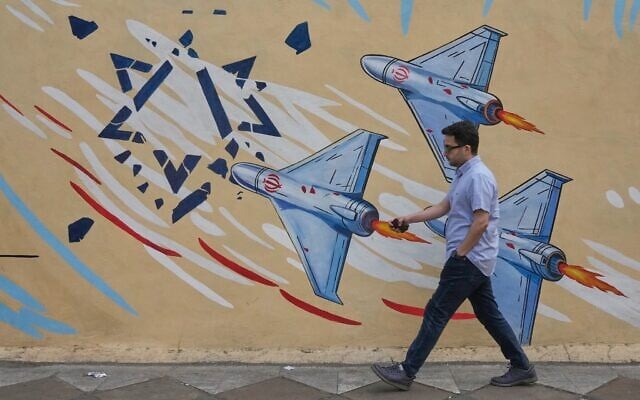 A man walks past an anti-Israel mural in downtown Tehran, Iran, May 17, 2026. (AP/Vahid Salemi)