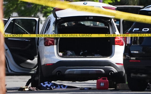 A Nazi "SS" branded gas can is seen on the ground near the vehicle allegedly belonging to one of the teenage shooters who opened fire outside a mosque, killing three, in San Diego, California, May 18, 2026. (AP Photo/Gregory Bull) A Nazi "SS" branded gas can is seen on the ground near the vehicle allegedly belonging to one of the teenage shooters who opened fire outside a mosque, killing three, in San Diego, California, May 18, 2026. (AP Photo/Gregory Bull)