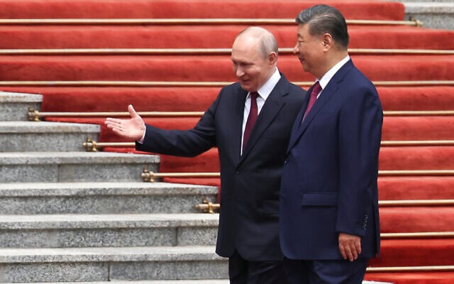 Russian President Vladimir Putin, left, walks with Chinese President Xi Jinping during a welcoming ceremony at the Great Hall of the People in Beijing, May 20, 2026. (Maxim Shemetov/Pool Photo via AP) Russian President Vladimir Putin, left, walks with Chinese President Xi Jinping during a welcoming ceremony at the Great Hall of the People in Beijing, May 20, 2026. (Maxim Shemetov/Pool Photo via AP)