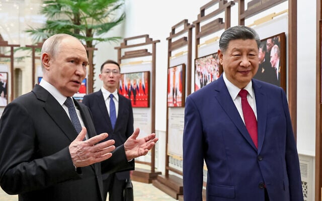 Russian President Vladimir Putin, left, and Chinese President Xi Jinping visit an exhibition by the TASS and Xinhua news agencies at the Great Hall of the People, in Beijing, China, on May 20, 2026. (Alexander Kazakov, Sputnik, Kremlin Pool Photo via AP) Russian President Vladimir Putin, left, and Chinese President Xi Jinping visit an exhibition by the TASS and Xinhua news agencies at the Great Hall of the People, in Beijing, China, on May 20, 2026. (Alexander Kazakov, Sputnik, Kremlin Pool Photo via AP)