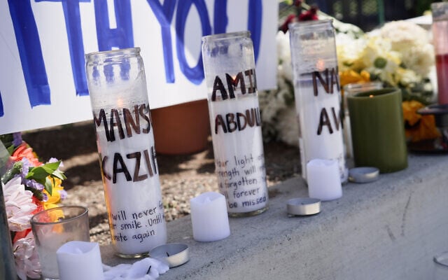 Candles with victims names are placed outside the Islamic Center of San Diego in the aftermath of a shooting on  May 20, 2026, in San Diego. (AP Photo/Ty Oneil)