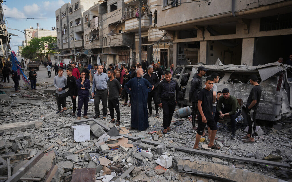 Palestinians inspect the rubble of the Ismail family home, destroyed in an Israeli airstrike at Al-Maghazi camp, in the central Gaza Strip, May 21, 2026. (AP Photo/Abdel Kareem Hana) Palestinians inspect the rubble of the Ismail family home, destroyed in an Israeli airstrike at Al-Maghazi camp, in the central Gaza Strip, May 21, 2026. (AP Photo/Abdel Kareem Hana)