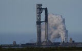 SpaceX's mega rocket Starship is prepared for a test flight that was later delayed, in Starbase, Texas, May 21, 2026. (AP Photo/Eric Gay)