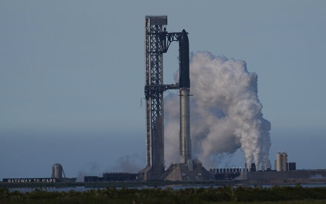 SpaceX's mega rocket Starship is prepared for a test flight that was later delayed, in Starbase, Texas, May 21, 2026. (AP Photo/Eric Gay)