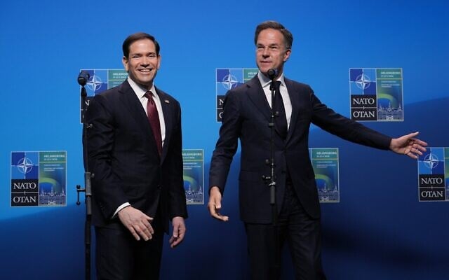 US Secretary of State Marco Rubio, left, and NATO Secretary General Mark Rutte walk off the podium after delivering a statement during a meeting of NATO foreign ministers in Helsingborg, Sweden, on May 22, 2026. (AP Photo/Julia Demaree Nikhinson, Pool)
