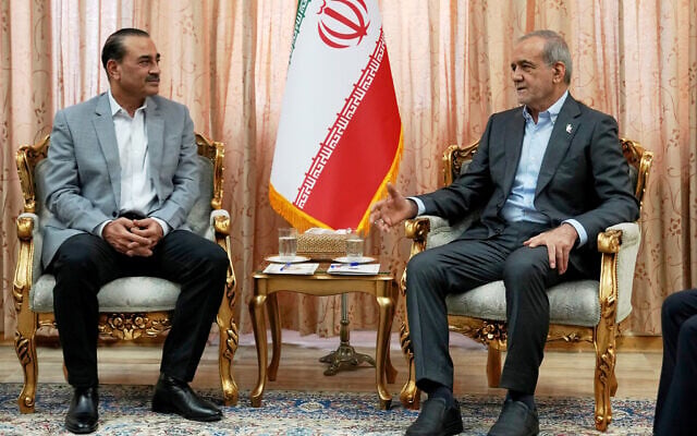 In this photo released by the Iranian Presidency Office, President Masoud Pezeshkian, right, speaks with Pakistan's Army Chief Field Marshal Gen. Asim Munir in Tehran, Iran, on May 23, 2026. (Iranian Presidency Office via AP)