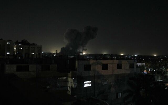 Smoke rises from an Israeli airstrike that targeted a building in Deir al-Balah, central Gaza Strip, May 23, 2026. (AP Photo/Abdel Kareem Hana)