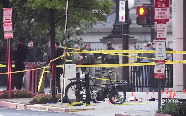 Evidence markers are seen on a crime scene after police responded to reports of shots fired near the White House, May 23, 2026, in Washington. (AP Photo/Alex Brandon) Evidence markers are seen on a crime scene after police responded to reports of shots fired near the White House, May 23, 2026, in Washington. (AP Photo/Alex Brandon)
