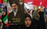 A woman holds a portrait of Iran's Supreme Leader, Ayatollah Mojtaba Khamenei, during a ceremony honoring the armed forces and those killed in the war with Israel and the US at the Imam Khomeini Grand Mosque in Tehran, Iran, on May 24, 2026. (AP Photo/Vahid Salemi)