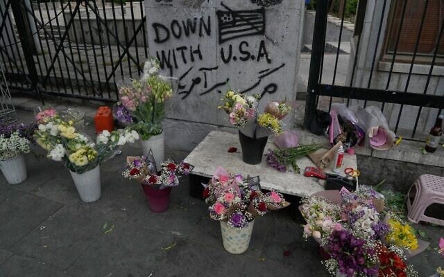 An anti-US graffiti is painted on a wall as flowers are displayed by a street vendor in downtown Tehran, Iran, May 24, 2026. (AP Photo/Vahid Salemi) An anti-US graffiti is painted on a wall as flowers are displayed by a street vendor in downtown Tehran, Iran, May 24, 2026. (AP Photo/Vahid Salemi)