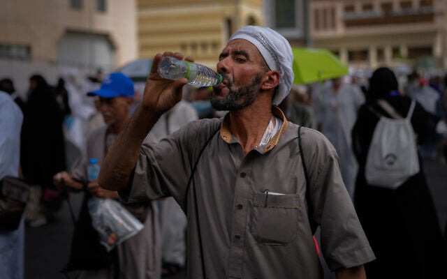 A Muslim pilgrim drinks water as he walks towards the Grand Mosque during the annual hajj pilgrimage at the holy city of Mecca, Saudi Arabia, May 24, 2026. (AP Photo/Altaf Qadri) A Muslim pilgrim drinks water as he walks towards the Grand Mosque during the annual hajj pilgrimage at the holy city of Mecca, Saudi Arabia, May 24, 2026. (AP Photo/Altaf Qadri)