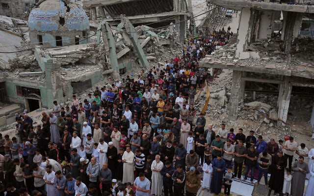 Palestinians offer Eid al-Adha prayers beside the ruins of a mosque destroyed by Israeli bombardment, in Khan Younis, southern Gaza Strip, on May 27, 2026. (AP Photo/Abdel Kareem Hana) Palestinians offer Eid al-Adha prayers beside the ruins of a mosque destroyed by Israeli bombardment, in Khan Younis, southern Gaza Strip, on May 27, 2026. (AP Photo/Abdel Kareem Hana)
