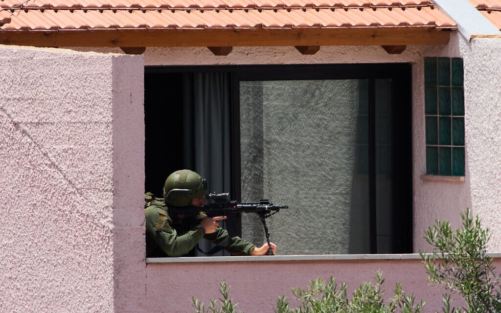 An Israeli solider takes a position in a house in the community of Metula, northern Israel, on the border with Lebanon, May 31, 2026. (AP Photo/Ariel Schalit)