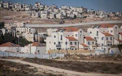 View of a newly constructed Jewish residential area in the East Jerusalem neighborhood of Pisgat Zeev, with the West Bank security barrier in the background, on November 19, 2019. (Hadas Parush/Flash90 )