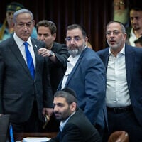 Prime Minister Benjamin Netanyahu and MKs attend a plenum session and a vote on reviving the ultra-Orthodox draft exemption bill at the assembly hall of the Knesset, in Jerusalem, on June 11, 2024. (Yonatan Sindel/Flash90)