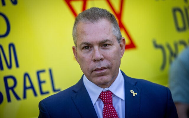 Gilad Erdan take part in a special ceremony for a new bulletproof ambulance donated by the Harvest Christian Fellowship to Magen David Adom, at the Tower of David in the Old City of Jerusalem, June 1, 2025. (Chaim Goldberg/Flash90)