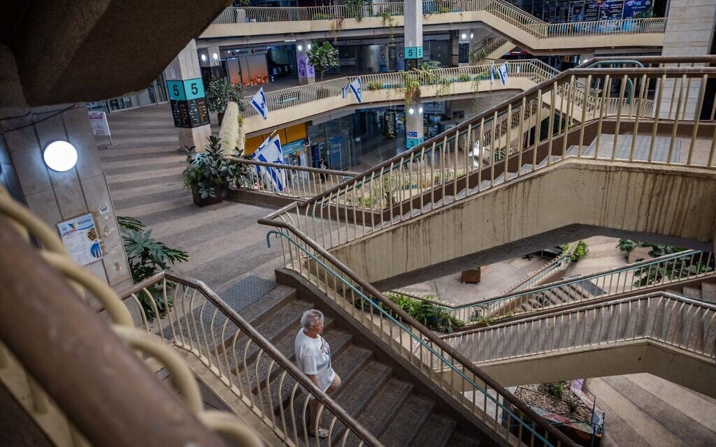 People walking inside the Clal building in central Jerusalem, on July 8, 2025 (Yonatan Sindel/Flash90)