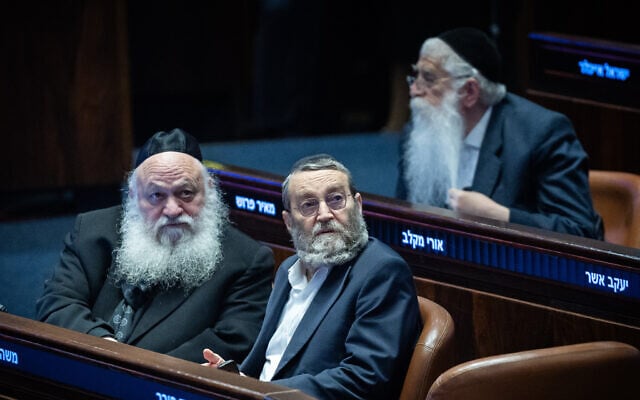 Degel HaTorah chair Moshe Gafni (R) and United Torah Judaism party chair Yitzhak Goldknopf attend a plenum session at the Knesset in Jerusalem, January 14, 2026 (Yonatan Sindel/Flash90)