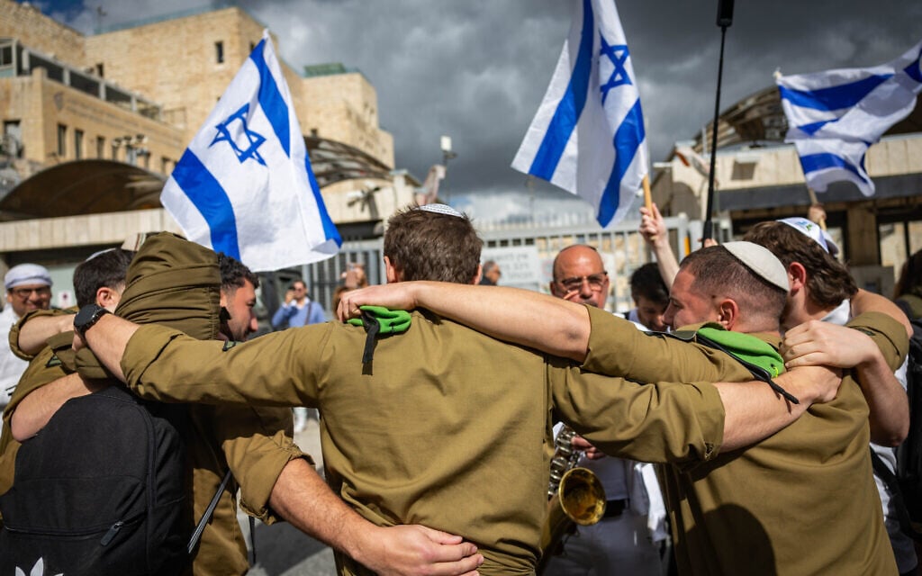 Lone soldiers in uniform celebrate their bar and bat mitzvah as Jews for the first time, after completing a conversion process during their military service, at the Western Wall in Jerusalem’s Old City, February 23, 2026. (Yonatan Sindel/ Flash90)