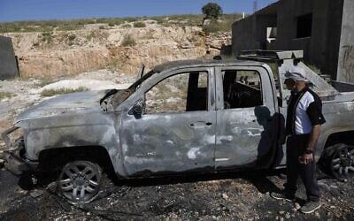 Palestinians inspect a burned vehicle following an attack by Israeli extremist settlers in the Wadi Rahim area of Hebron in the West Bank, May 1, 2026. (Wisam Hashlamoun/Flash90) Palestinians inspect a burned vehicle following an attack by Israeli extremist settlers in the Wadi Rahim area of Hebron in the West Bank, May 1, 2026. (Wisam Hashlamoun/Flash90)
