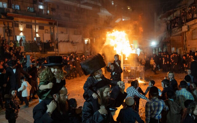 People celebrate the Jewish holiday of Lag B'Omer in ultra-Orthodox neighborhood of Mea Shearim in Jerusalem on May 4, 2026. (Yonatan Sindel/Flash90)