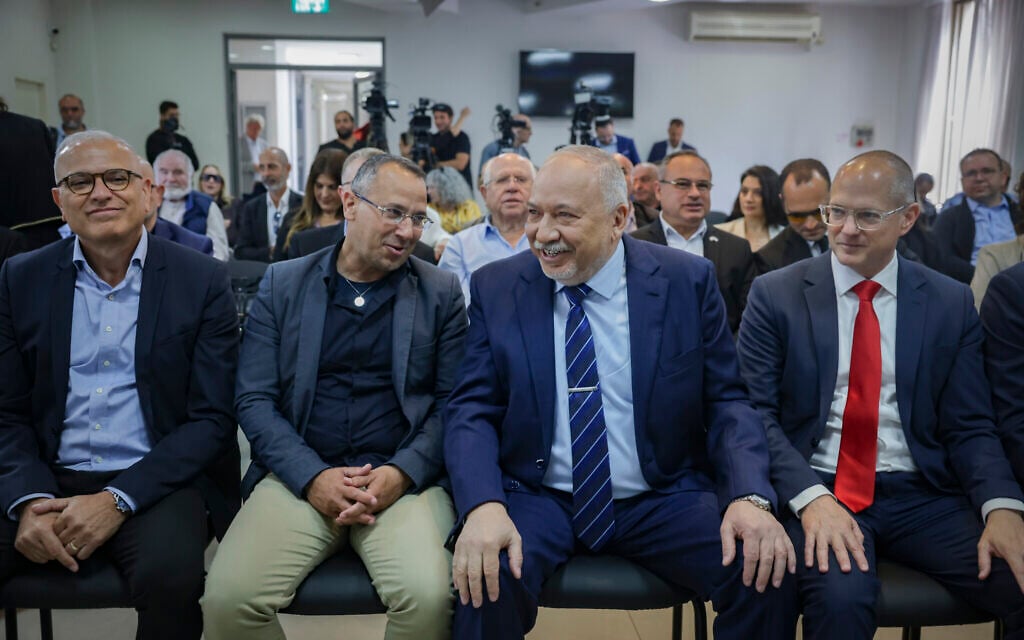 MK Avigdor Lieberman is seen with party members and fellow Knesset members before holding a press conference in Tel Aviv, May 6, 2026. (Miriam Alster/Flash90)