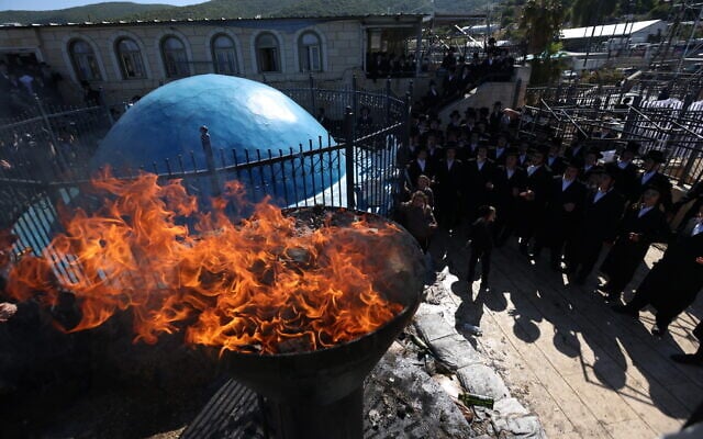 The leader of the Chernobyl Hassidic sect in Ashdod and his followers take part in a prayer and bonfire lighting ceremony days after Lag B'Omer in Meron, northern Israel, May 7, 2026. (David Cohen/Flash90)