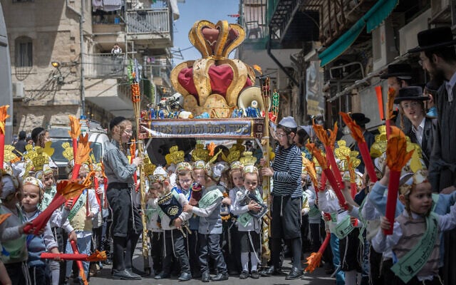 Children from the Toldot Aharon Talmud Torah march through the Mea She'arim neighborhood in Jerusalem ahead of the Shavuot holiday, May 19, 2026.(Chaim Goldberg/FLASH90)