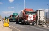 Trucks carrying medical supplies line up to bring equipment into Gaza for the expansion of a Red Cross field hospital coordinated by COGAT, May 8, 2026. (COGAT)