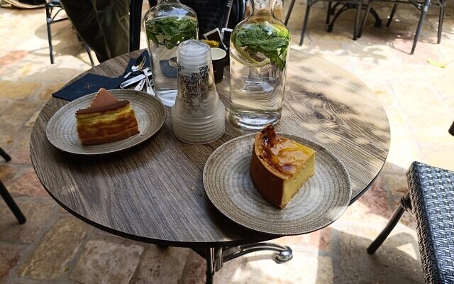 Cheesecake (L) and flan at Moulin Doré in Jerusalem (Zev Stub/Times of Israel)