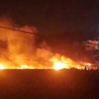 Screen capture from video of fields allegedly set alight by extremist Israeli settlers near the West Bank village of Al-Mughayyir, May 18, 2026. (X)