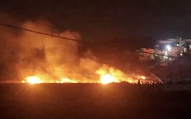 Screen capture from video of fields allegedly set alight by extremist Israeli settlers near the West Bank village of Al-Mughayyir, May 18, 2026. (X)